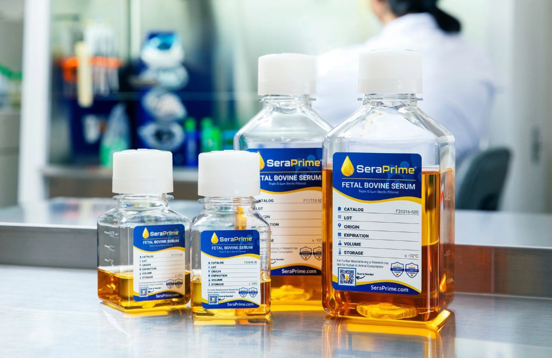 serum-bottles-with-medical-lab-behind-it serum bottles with medical lab behind it